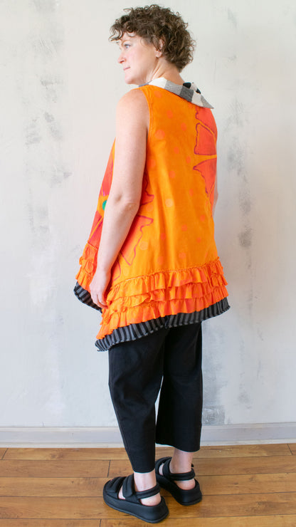 Petal Pusher Peplum top in Orange Crush