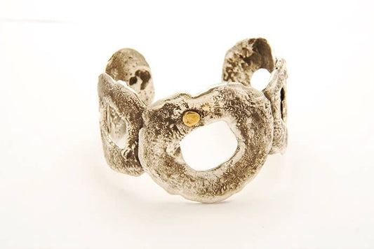 Reticulated cuff with bronze