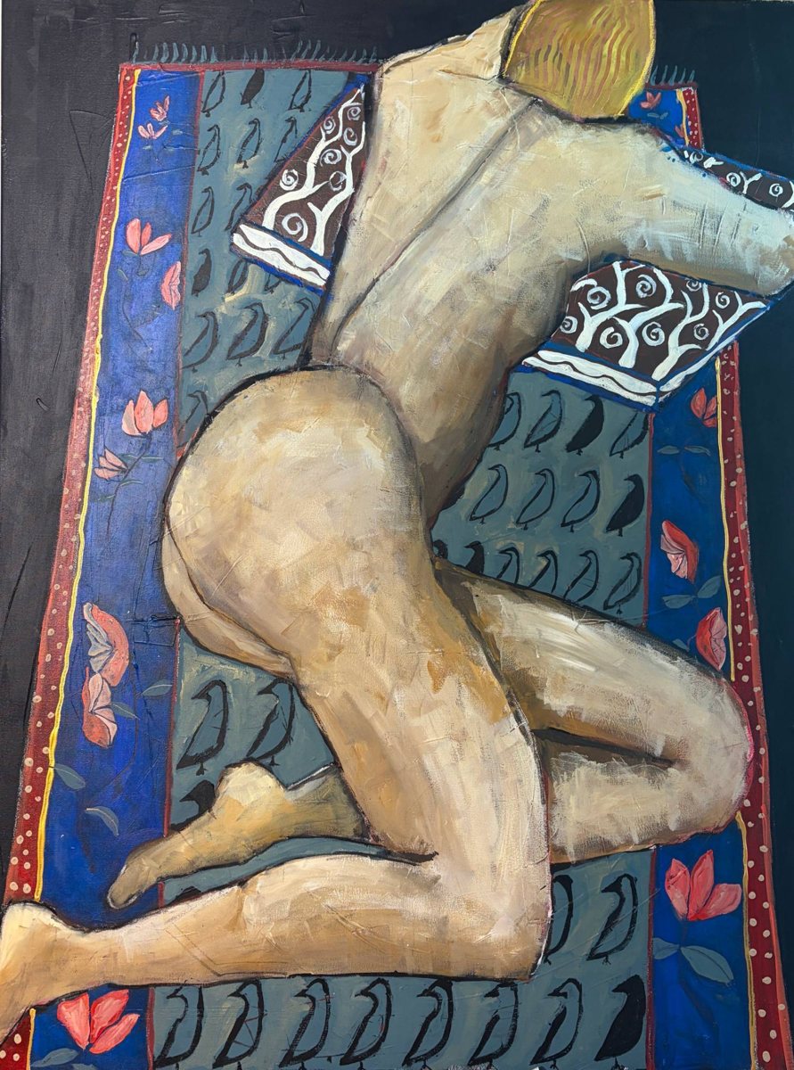 Painted figure resting on a patterned rug, at Pure Space, Gaia