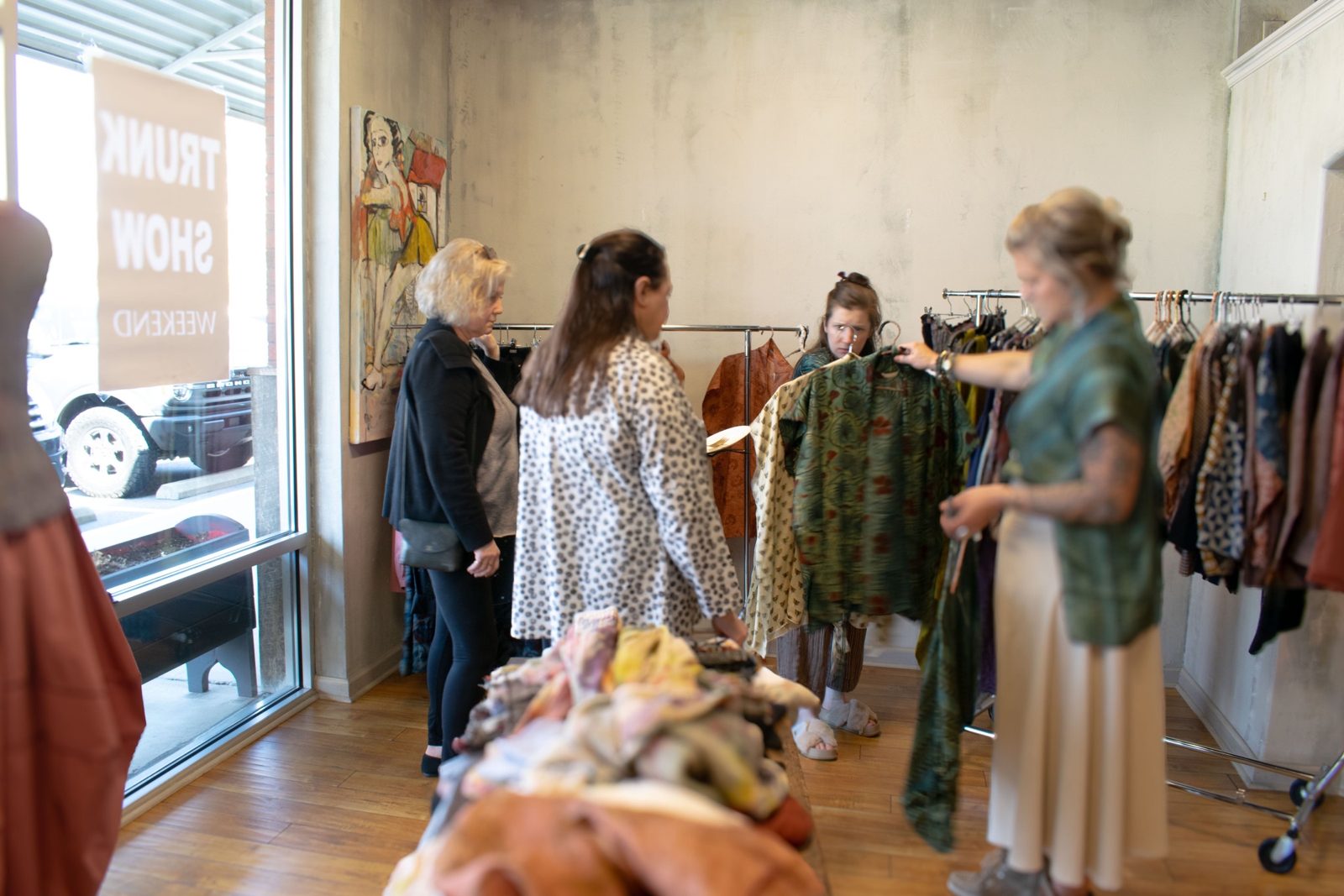 Customers at a trunk show at Gaia